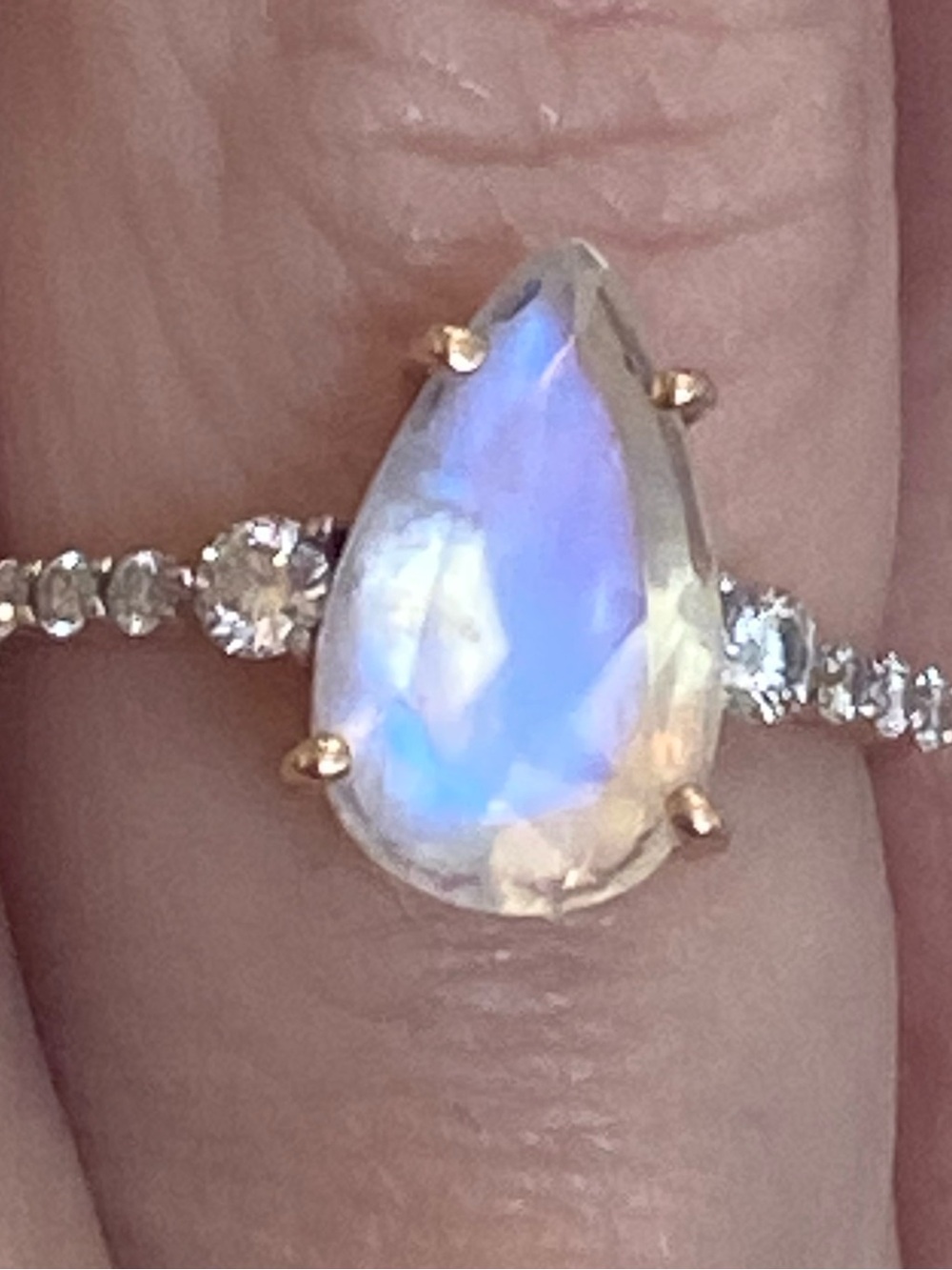 Pear-Shaped Blue Opalescent Teardrop Ring with Pavé Band